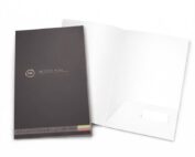 Custom presentation folder printing for businesses, dark gray printed cover with white unprinted inside pocket, professional marketing folder