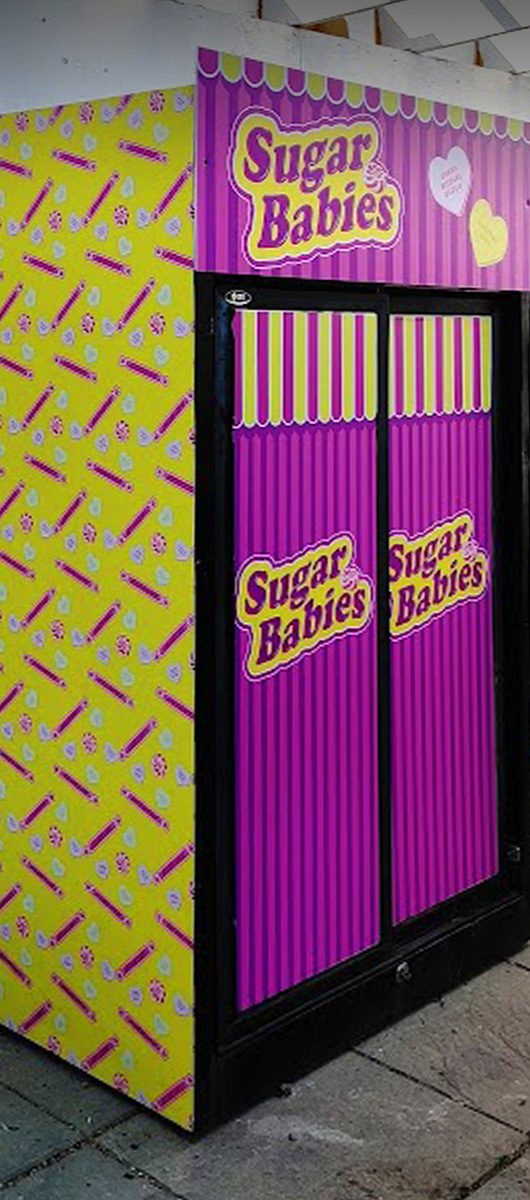 Custom vinyl wrap for commercial refrigerator display with vibrant branded graphics in Toronto GTA