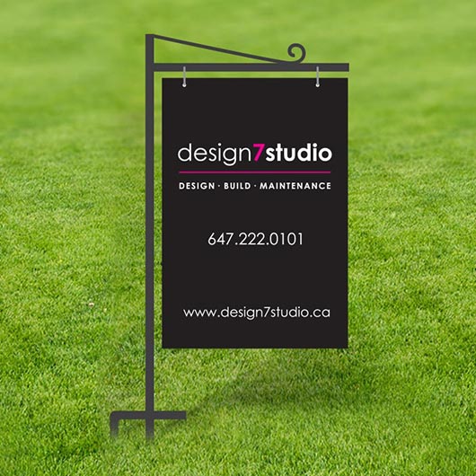 Crane-style metal frame lawn sign with hanging printed panel installed on grass, popular for real estate advertising
