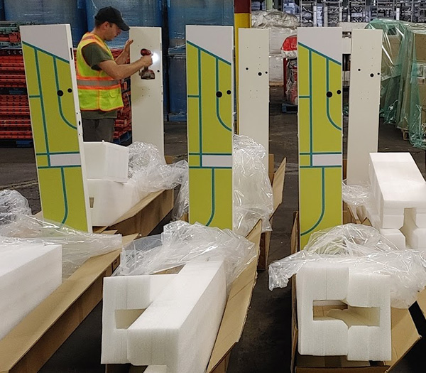 Professional vinyl wrap installation on EV charging station panels with custom branded graphics in Toronto GTA