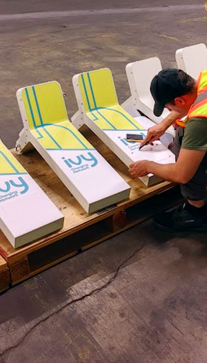 Custom vinyl wrap application on EV charging station components with precision graphic installation in Toronto GTA