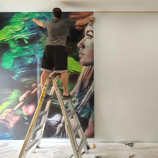 Professional wall mural installation in commercial interior space