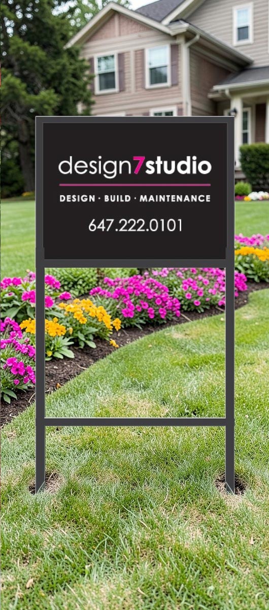 Metal frame lawn sign with custom printed panel installed on a residential front lawn for real estate or service advertising