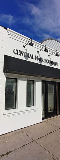 Black Custom Storefront Awning for Retail Shop Custom black storefront awning installed above retail boutique entrance