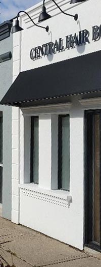 Custom Fabric Storefront Awning Custom black storefront awning installed above retail boutique entrance