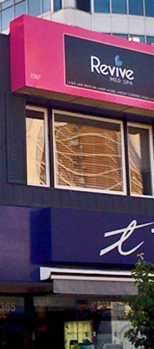 Large custom storefront awning canopy with printed business branding